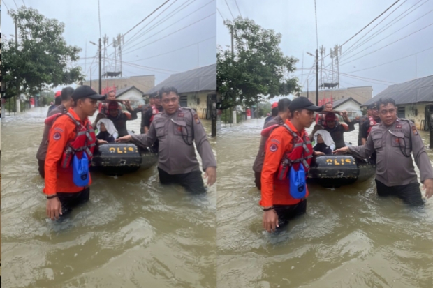 Pammat Subdit Gasum Polda Sulsel Evakuasi Korban Banjir di Makassar